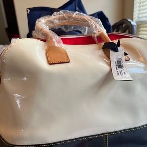 Brand new Dooney & Burke dome baf